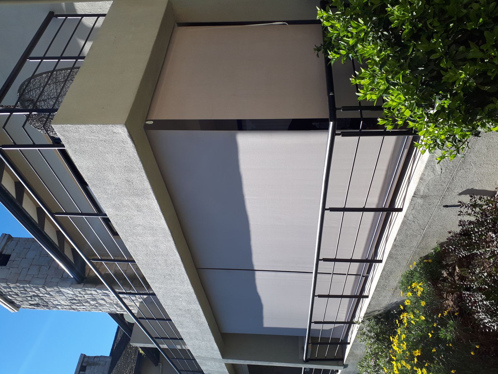 Blinds down on a first-floor balcony