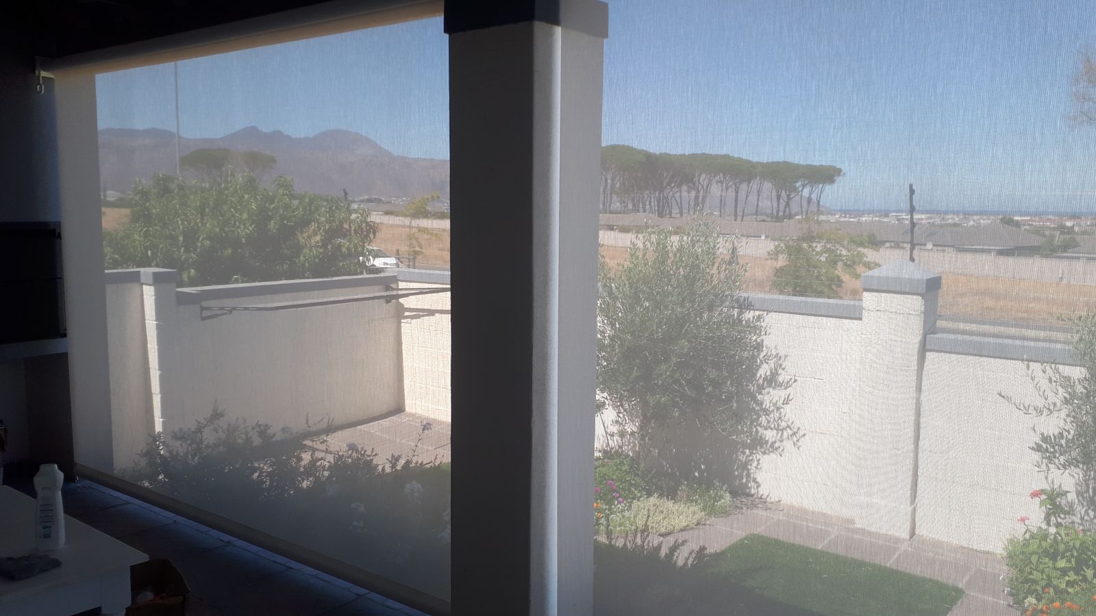Mesh blind with a view over the valley